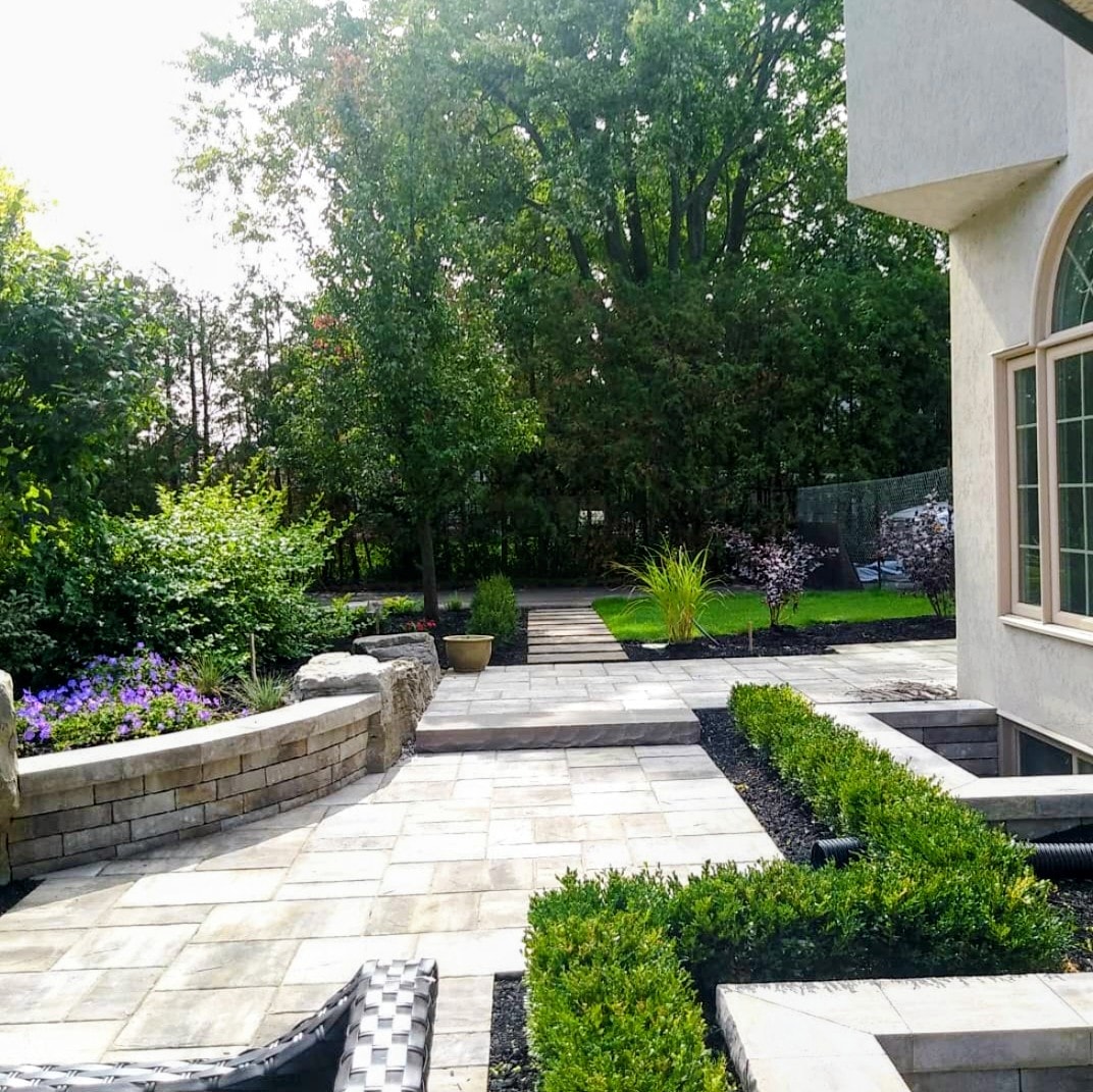 Lush garden landscape with stone and plantings